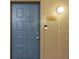 Blue front door with unit number 2218 and a lit lightbulb for added security at night at 400 17Th Nw St # 2218, Atlanta, GA 30363
