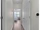 Bright hallway leads to a bedroom with ample closet space and a neutral color palette at 400 17Th Nw St # 2218, Atlanta, GA 30363
