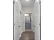 Hallway view showcasing access to a well-lit bathroom with modern fixtures at 400 17Th Nw St # 2218, Atlanta, GA 30363