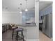 Kitchen featuring stainless steel appliances, breakfast bar, and blue cabinets, perfect for modern living at 400 17Th Nw St # 2218, Atlanta, GA 30363