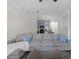 Inviting living room features a comfortable gray sofa and a view into the modern kitchen at 400 17Th Nw St # 2218, Atlanta, GA 30363