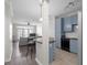 Open-concept living area boasts hardwood floors, modern lighting and a bar overlooking the kitchen at 400 17Th Nw St # 2218, Atlanta, GA 30363