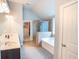 Bathroom featuring a walk-in closet, walk-in shower, soaking tub and double vanity at 4349 Sublime Trl, Atlanta, GA 30349