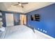 Primary bedroom featuring blue wall accents, large window, and neutral carpet at 4349 Sublime Trl, Atlanta, GA 30349