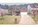 Lovely two-story brick home featuring a manicured lawn and a two-car garage at 4349 Sublime Trl, Atlanta, GA 30349