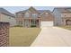 Classic brick two-story home with an attached garage and well-maintained front yard at 4349 Sublime Trl, Atlanta, GA 30349