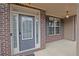 Elegant front door with sidelights and transom window, set in a brick facade at 4349 Sublime Trl, Atlanta, GA 30349