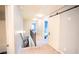 Hallway with carpeted flooring, light grey walls and access to other rooms at 4349 Sublime Trl, Atlanta, GA 30349