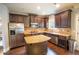 Modern kitchen with dark wood cabinets, stainless steel appliances, and a granite-topped island at 4349 Sublime Trl, Atlanta, GA 30349