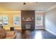 A living room with a dark wood fireplace, mantle and hardwood flooring at 4349 Sublime Trl, Atlanta, GA 30349