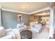 Elegant living room with crown molding, neutral colors, and comfortable seating arrangement near dining area at 4349 Sublime Trl, Atlanta, GA 30349