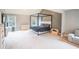 A spacious main bedroom with neutral decor, large windows and carpeted flooring at 4349 Sublime Trl, Atlanta, GA 30349