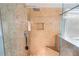 Walk-in shower featuring dual shower heads, built-in seat, and tiled walls at 4349 Sublime Trl, Atlanta, GA 30349