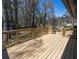 A spacious, newly constructed wooden back deck with railings, perfect for outdoor living at 6727 Kull Dr, Lithia Springs, GA 30122