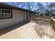A spacious, newly constructed wooden back deck with access to the home's back entrance at 6727 Kull Dr, Lithia Springs, GA 30122