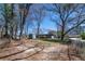 Expansive backyard featuring a storage shed and fenced perimeter, offering privacy and convenience at 6727 Kull Dr, Lithia Springs, GA 30122