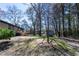 Spacious backyard featuring a wooden deck, perfect for outdoor gatherings and relaxation at 6727 Kull Dr, Lithia Springs, GA 30122