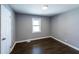 Cozy bedroom featuring a window, closet, and modern finishes at 6727 Kull Dr, Lithia Springs, GA 30122
