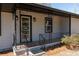 Inviting front porch with decorative iron railings and classic tile flooring detail at 6727 Kull Dr, Lithia Springs, GA 30122