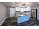 Modern kitchen with white cabinets, stainless steel appliances, granite countertops, and island at 6727 Kull Dr, Lithia Springs, GA 30122
