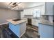 Bright, modern kitchen with granite countertops, white cabinetry and stainless appliances at 6727 Kull Dr, Lithia Springs, GA 30122