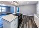 Spacious kitchen featuring an island cooktop, granite countertops, and ample natural light at 6727 Kull Dr, Lithia Springs, GA 30122