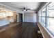 Spacious living room with hardwood floors leading to kitchen and natural lighting at 6727 Kull Dr, Lithia Springs, GA 30122