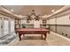 Finished basement with a pool table, recessed lighting, and access to the outside at 803 Amerden Ponds Ct, Johns Creek, GA 30097