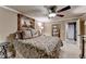 Cozy bedroom with decorative ceiling fan, comfortable bedding, and stylish decor creating a relaxing space at 803 Amerden Ponds Ct, Johns Creek, GA 30097
