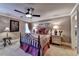 Cozy bedroom featuring a decorative ceiling fan, carpeted floors, and an abundance of natural light at 803 Amerden Ponds Ct, Johns Creek, GA 30097