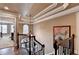 Beautiful hallway with hardwood floors, decorative ceiling, custom staircase, and chandelier at 803 Amerden Ponds Ct, Johns Creek, GA 30097