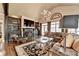 Bright living room with a vaulted ceiling, custom built-ins, and large windows providing lots of natural light at 803 Amerden Ponds Ct, Johns Creek, GA 30097