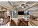 This media room features a large TV, built-in shelving, and comfortable seating perfect for relaxation and entertainment at 803 Amerden Ponds Ct, Johns Creek, GA 30097