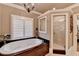 Elegant main bathroom with a soaking tub and walk-in shower at 803 Amerden Ponds Ct, Johns Creek, GA 30097