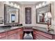 A vanity area with granite countertop and decorative accents at 803 Amerden Ponds Ct, Johns Creek, GA 30097