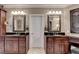 A main bathroom featuring granite countertops and dual sinks at 803 Amerden Ponds Ct, Johns Creek, GA 30097