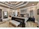 Well-decorated bedroom featuring a trey ceiling, chandelier, and ample natural light at 803 Amerden Ponds Ct, Johns Creek, GA 30097