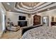 Spacious main bedroom featuring a tray ceiling and decorative furnishings at 803 Amerden Ponds Ct, Johns Creek, GA 30097