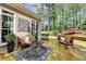 Charming outdoor patio with comfortable seating, ideal for enjoying the serene backyard at 803 Amerden Ponds Ct, Johns Creek, GA 30097