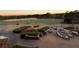 Outdoor patio seating overlooks the golf course and beautifully landscaped gardens at 803 Amerden Ponds Ct, Johns Creek, GA 30097