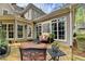 Cozy outdoor patio area with comfortable seating and decorative elements at 803 Amerden Ponds Ct, Johns Creek, GA 30097