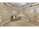 This cozy sitting room features neutral tones, soft lighting, comfortable seating, and a decorative cabinet at 803 Amerden Ponds Ct, Johns Creek, GA 30097