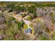 Aerial shot of a home nestled among trees, highlighting the property's natural setting at 263 Keller Dr, Mcdonough, GA 30252
