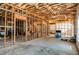 Spacious unfinished basement with exposed beams and concrete flooring at 263 Keller Dr, Mcdonough, GA 30252