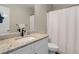 Simple bathroom with granite countertop vanity, single sink, and tiled shower at 263 Keller Dr, Mcdonough, GA 30252