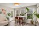 Inviting breakfast nook featuring a marble table, woven chairs, and views of the outdoors at 263 Keller Dr, Mcdonough, GA 30252