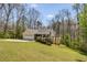 The home features a well-manicured lawn, an attached garage, and a charming, inviting exterior at 263 Keller Dr, Mcdonough, GA 30252