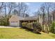 Charming ranch-style home featuring manicured lawn, attached garage, and a quaint front porch with inviting curb appeal at 263 Keller Dr, Mcdonough, GA 30252