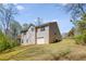 Exterior showcasing a two-story home with a garage and a lush green lawn at 263 Keller Dr, Mcdonough, GA 30252