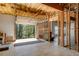 Unfinished garage offering natural light and framing for customization at 263 Keller Dr, Mcdonough, GA 30252